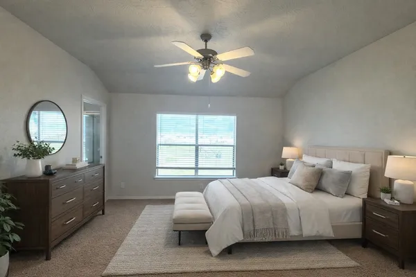 a view of an empty room with a ceiling fan
