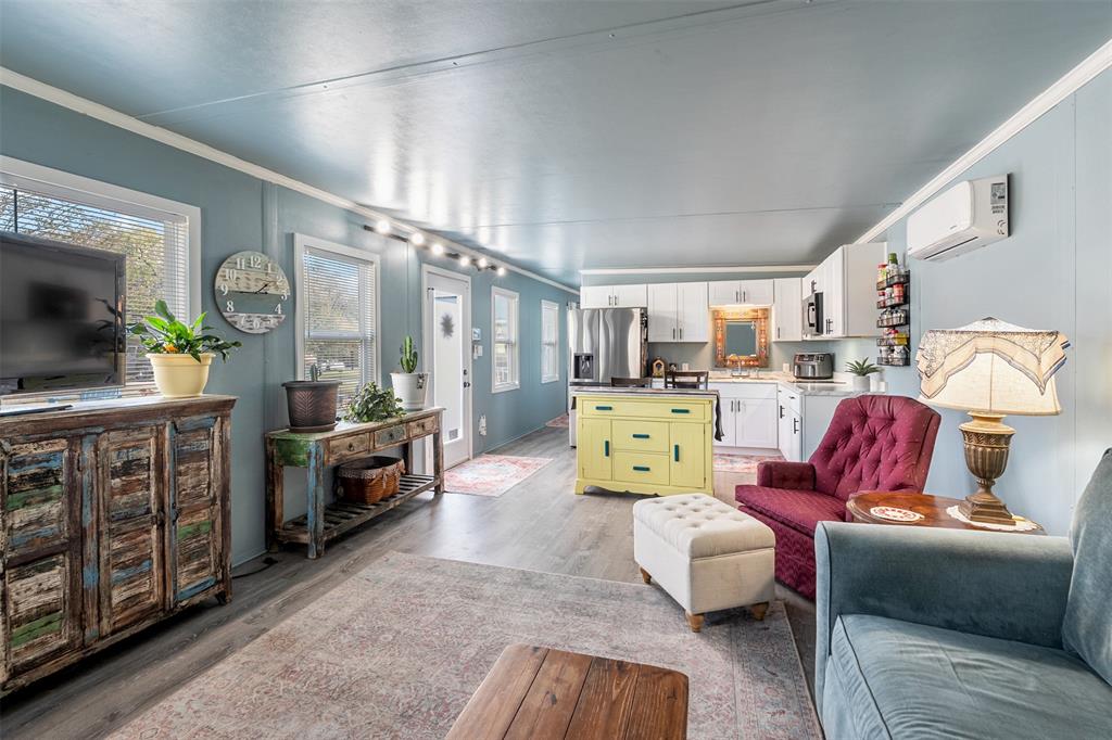 205 Scott Lane Mabank, TX 75156 - Photo 4 of 21 a bedroom with furniture and a flat screen tv