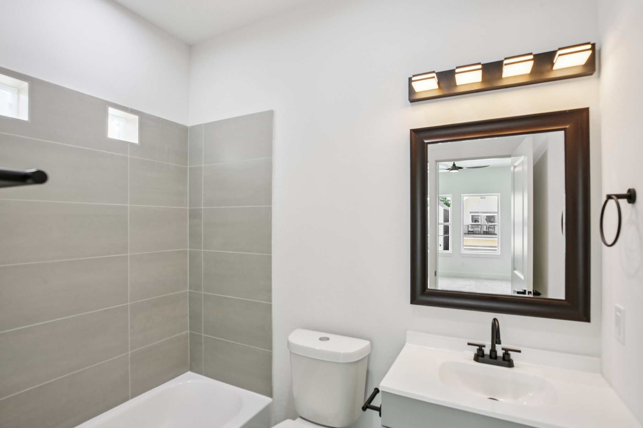 3514 Good Hope Street, Unit F Houston, TX 77021 - Photo 20 of 27 a bathroom with a toilet sink and mirror