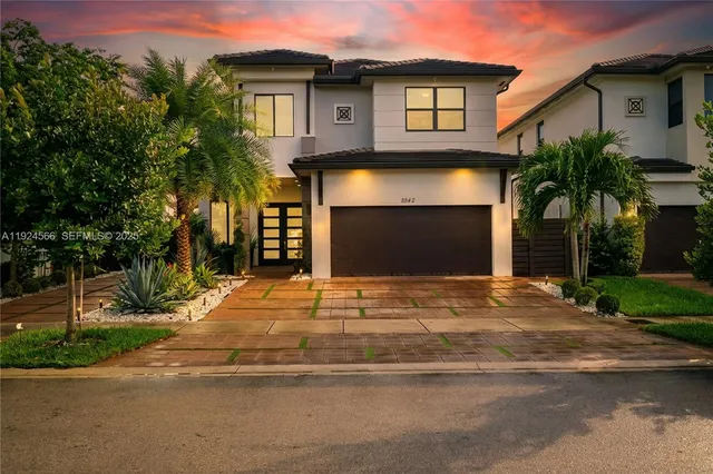 a front view of a house with yard