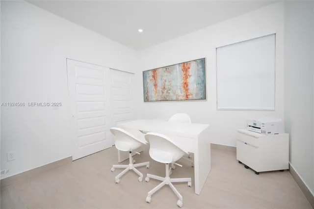 a dining room with furniture and wooden floor