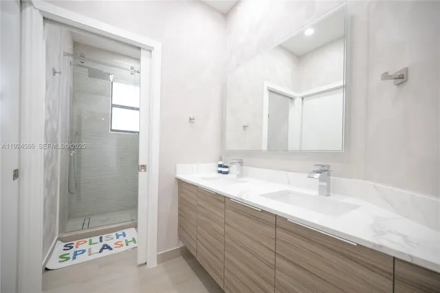 a bedroom with furniture and white walls