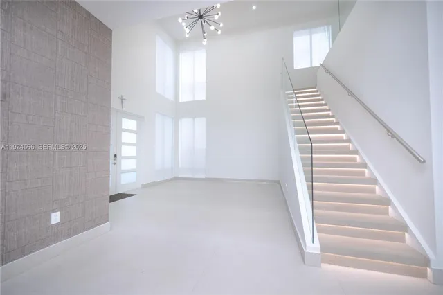 a bedroom with a bed and a ceiling fan