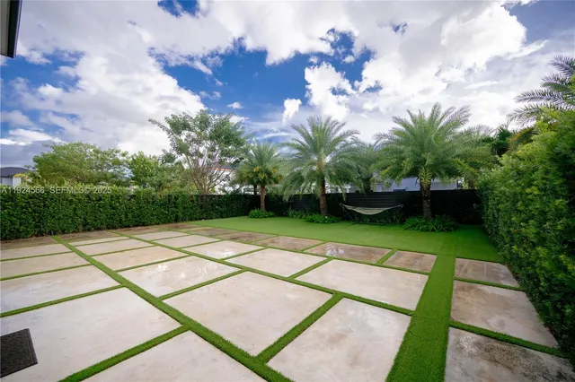 a view of a backyard of a house