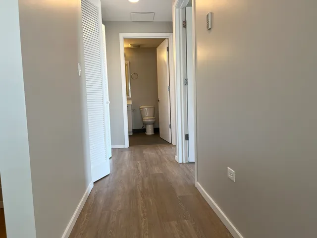a view of a balcony with wooden floor