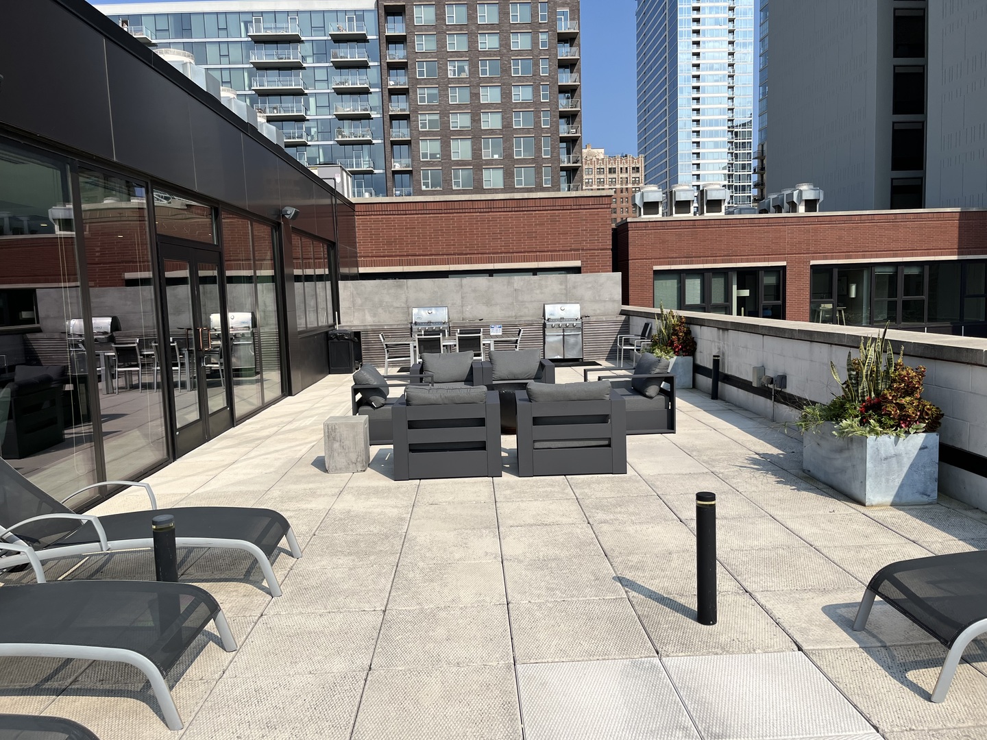 211 West Scott Street, Unit 508 Chicago, IL 60610 - Photo 17 of 22 a outdoor space with patio couches and a potted plant