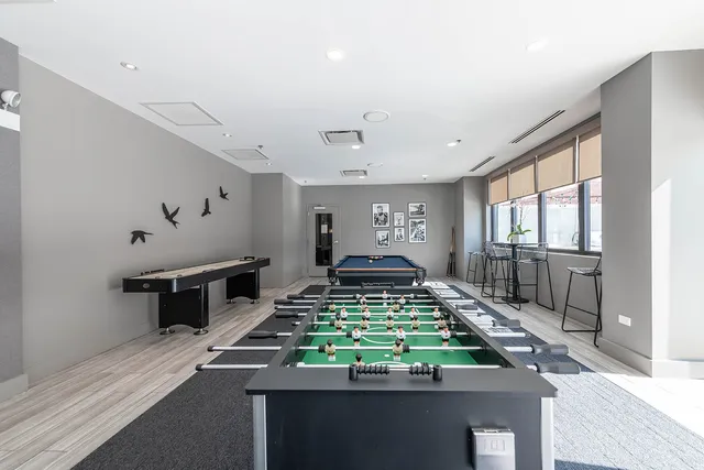 a view of a backyard with a chair and a potted plant