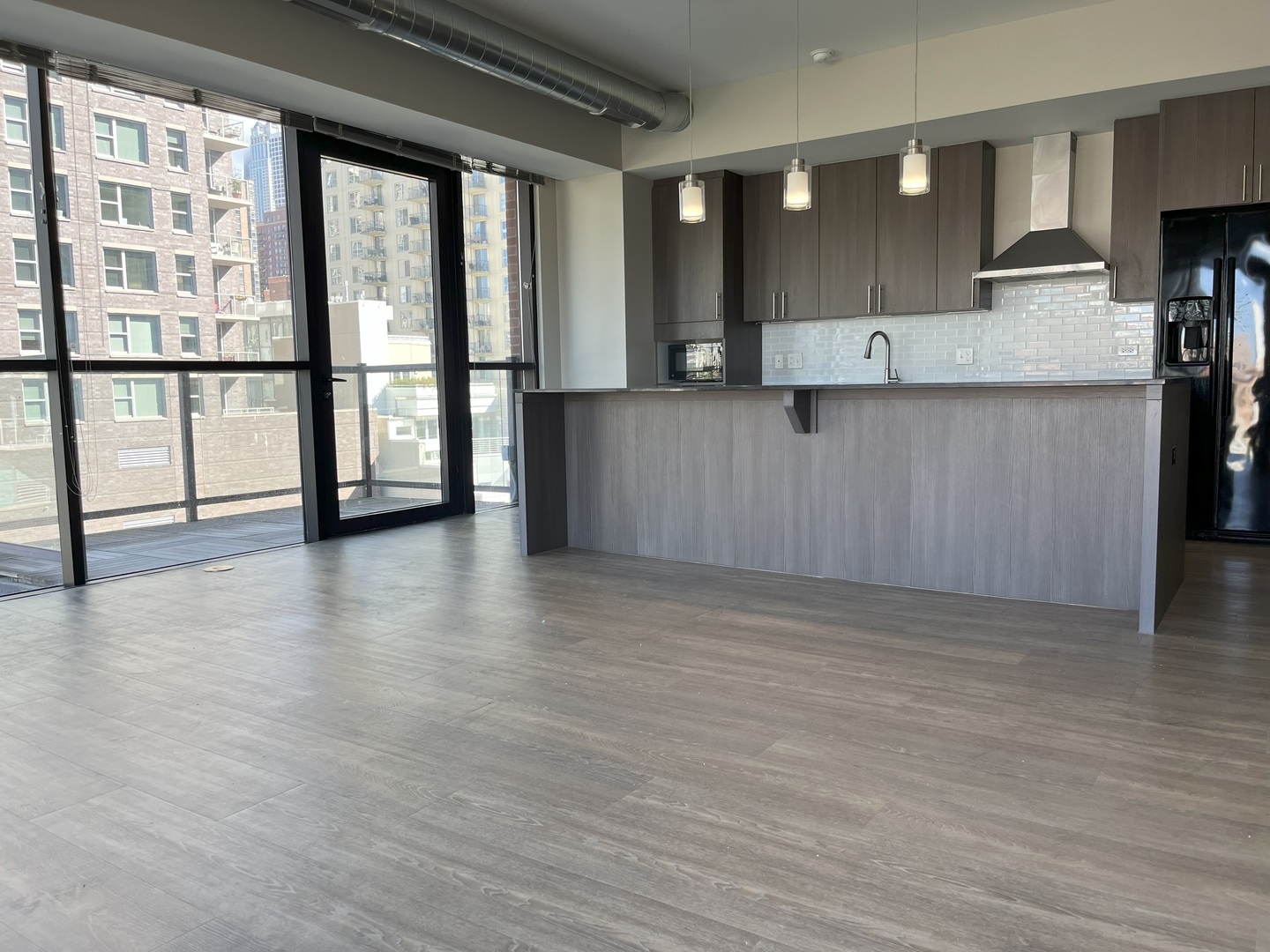 211 West Scott Street, Unit 508 Chicago, IL 60610 - Photo 2 of 22 a view of a kitchen with stainless steel appliances granite countertop a stove and a large window