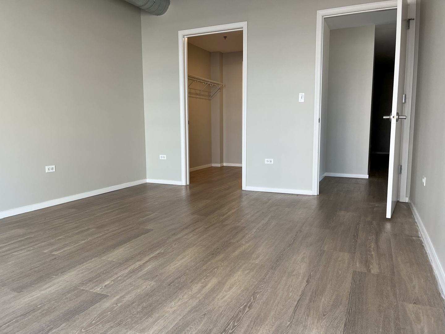 211 West Scott Street, Unit 508 Chicago, IL 60610 - Photo 9 of 22 a view of an empty room with wooden floor & closet