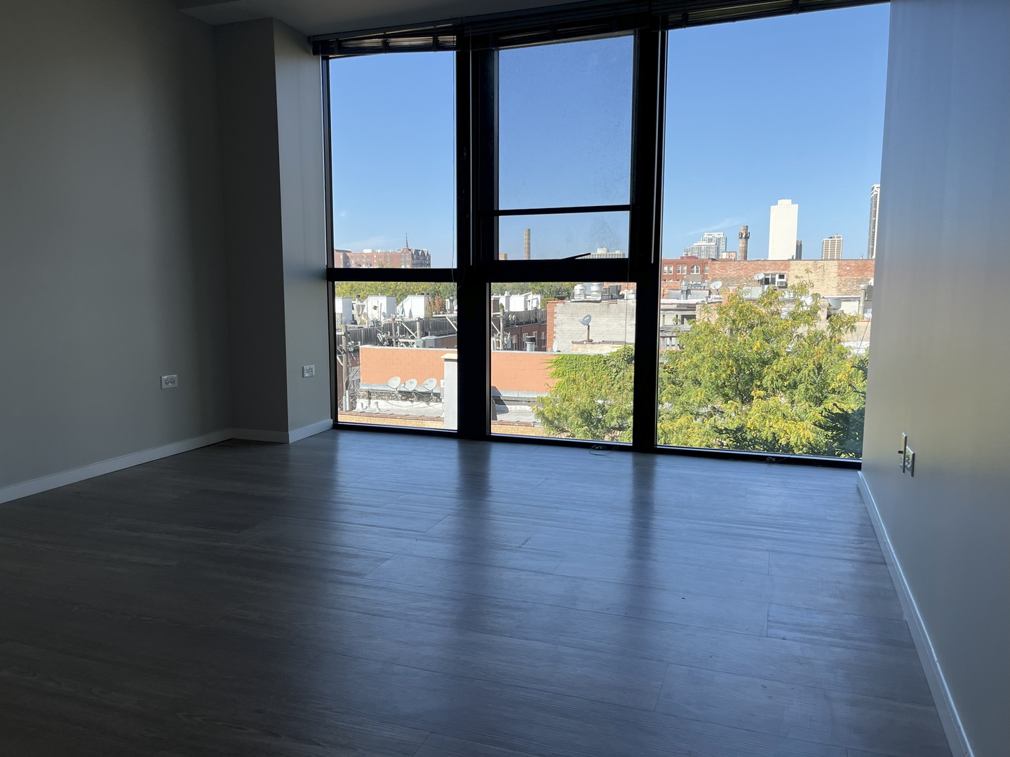 211 West Scott Street, Unit 508 Chicago, IL 60610 - Photo 10 of 22 a view of a room with wooden floor and floor to ceiling window