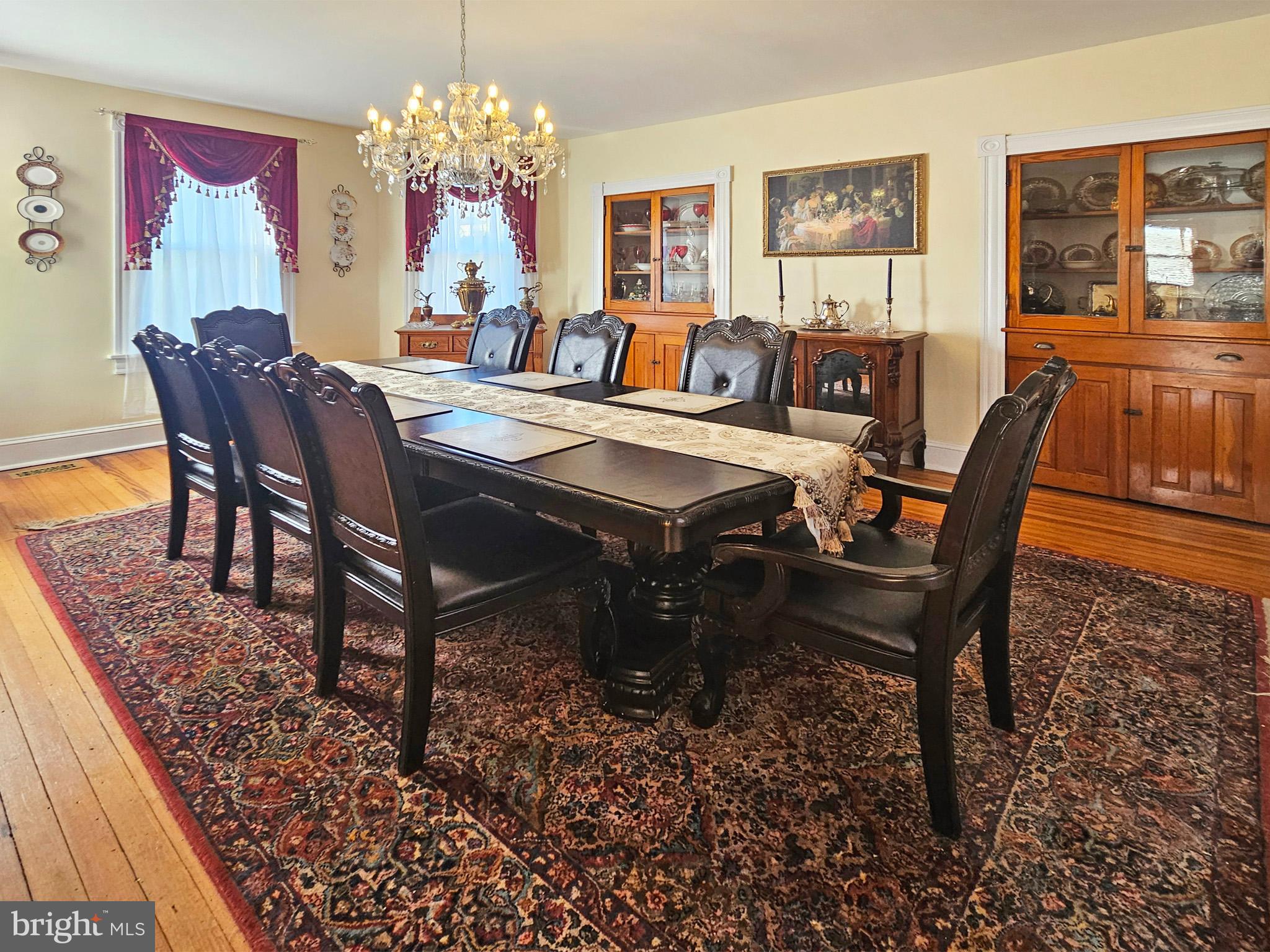 20 Blue Ridge Avenue Front Royal, VA 22630 - Photo 17 of 51 a view of a dining room with furniture a chandelier and wooden floor