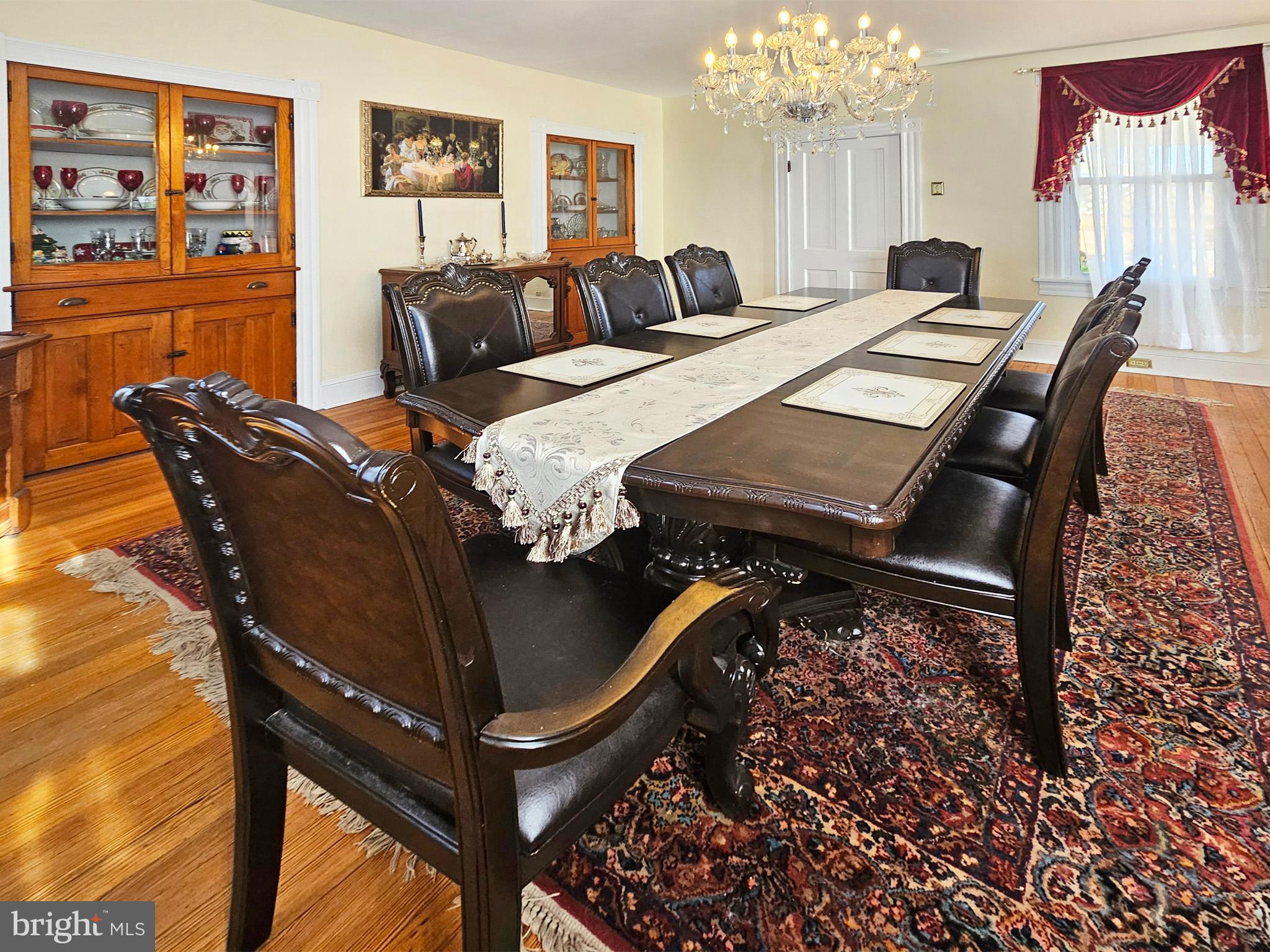 20 Blue Ridge Avenue Front Royal, VA 22630 - Photo 18 of 51 a living room with furniture a chandelier and a dining table