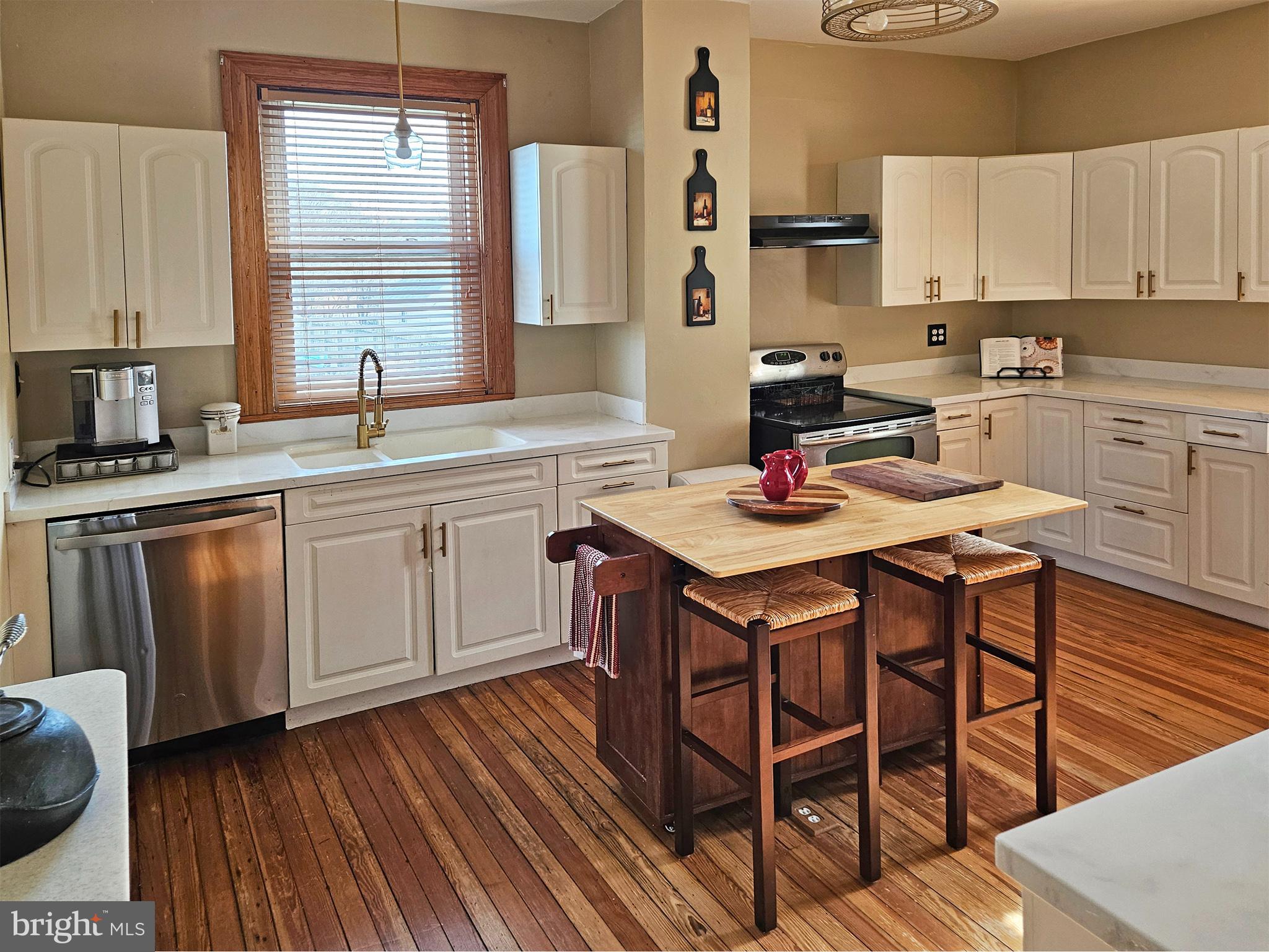 20 Blue Ridge Avenue Front Royal, VA 22630 - Photo 21 of 51 a kitchen with a sink cabinets and window