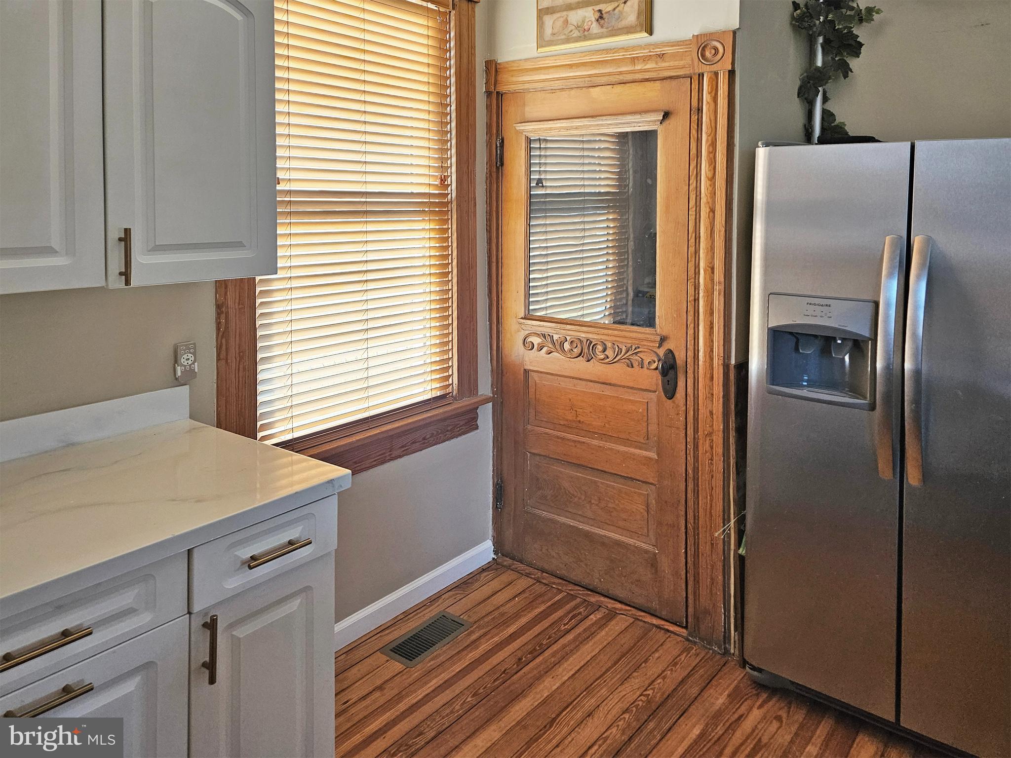20 Blue Ridge Avenue Front Royal, VA 22630 - Photo 24 of 51 a kitchen with a refrigerator and window