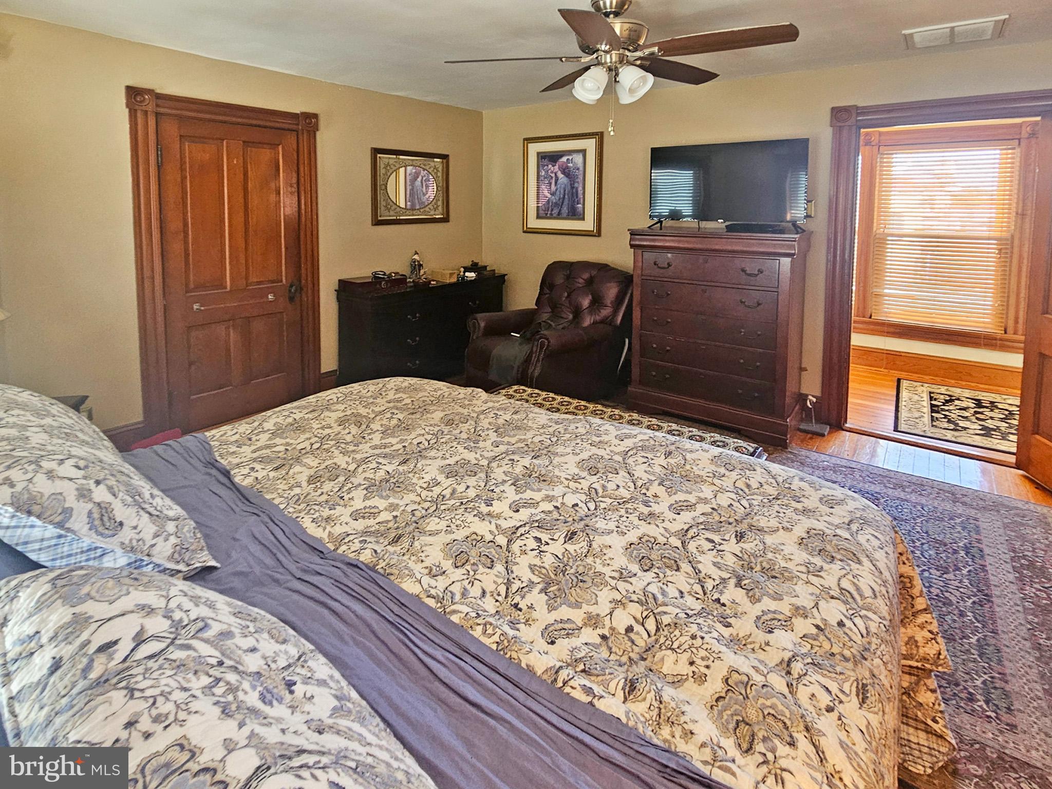 20 Blue Ridge Avenue Front Royal, VA 22630 - Photo 30 of 51 a bedroom with a bed and wooden floor