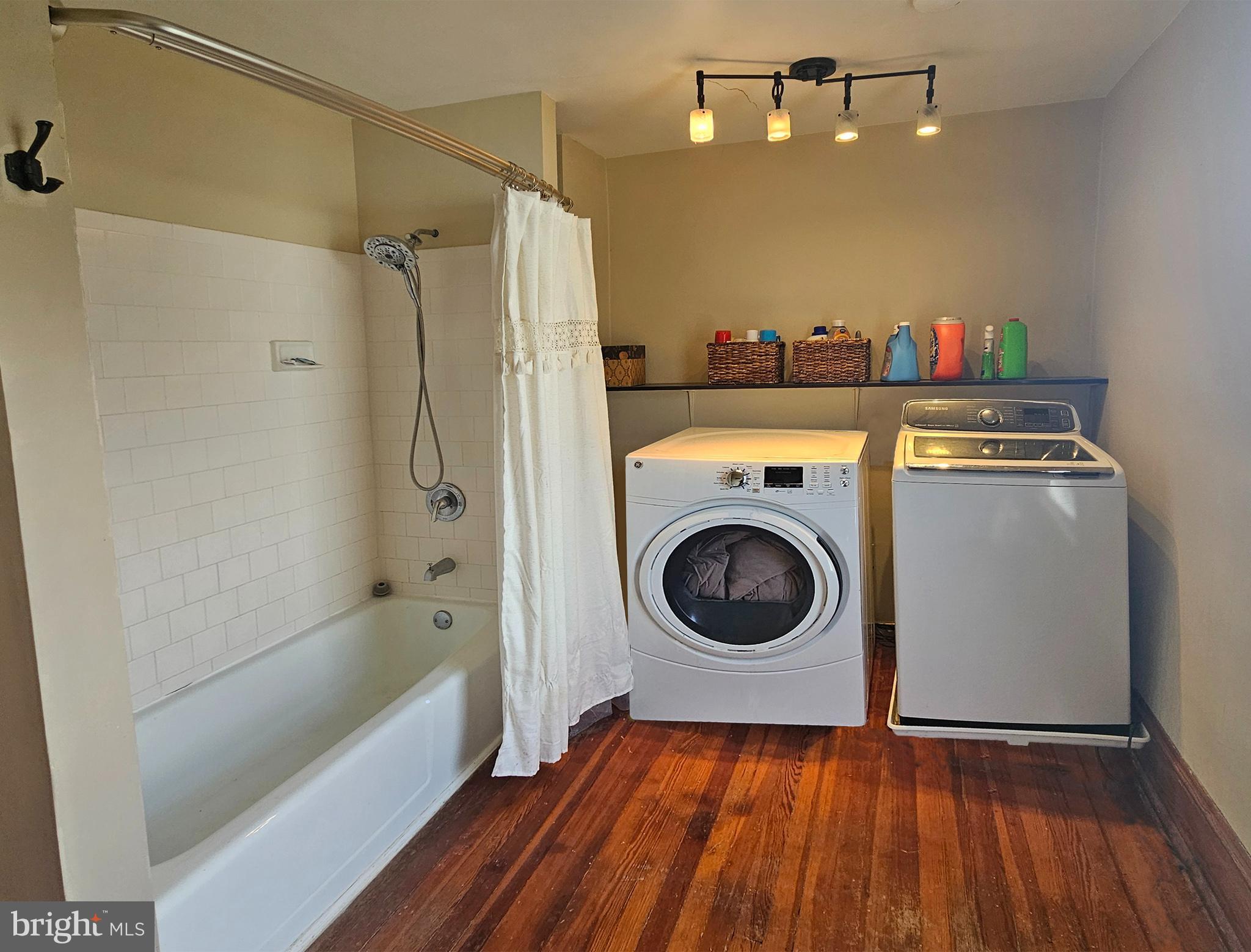 20 Blue Ridge Avenue Front Royal, VA 22630 - Photo 32 of 51 a bathroom with a sink a bath tub and a washer dryer