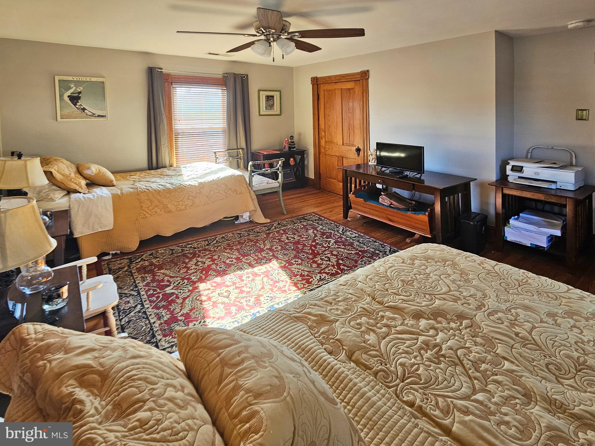 20 Blue Ridge Avenue Front Royal, VA 22630 - Photo 39 of 51 a bedroom with a bed and wooden floor