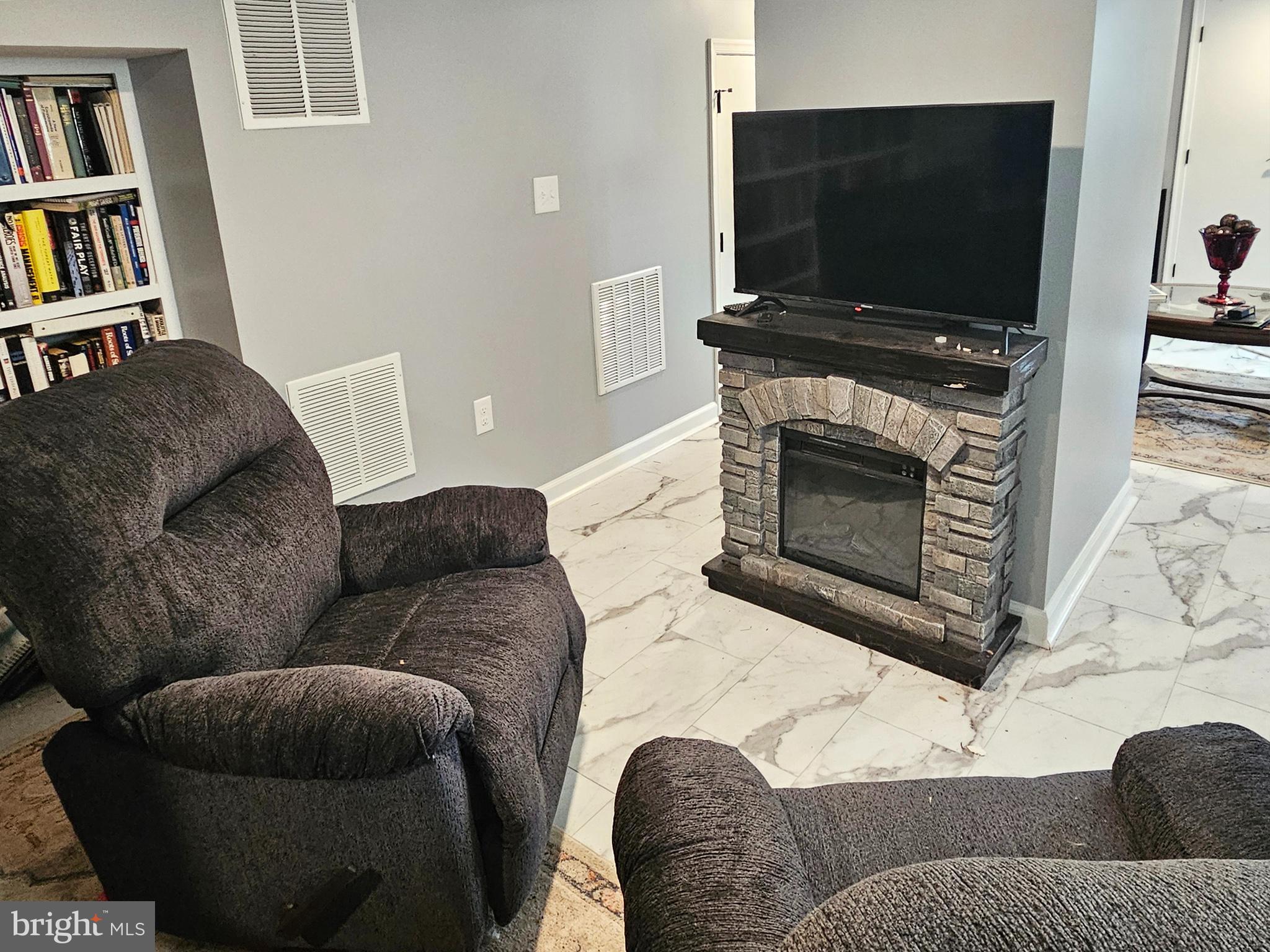 20 Blue Ridge Avenue Front Royal, VA 22630 - Photo 41 of 51 a living room with furniture and a flat screen tv