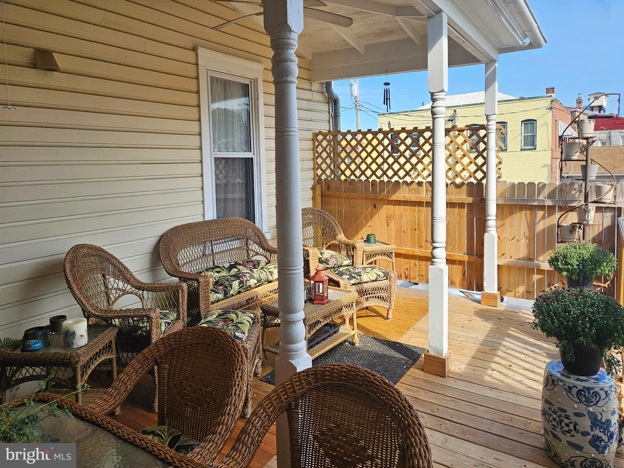 20 Blue Ridge Avenue Front Royal, VA 22630 - Photo 46 of 51 a view of a chairs and table in patio with wooden fence