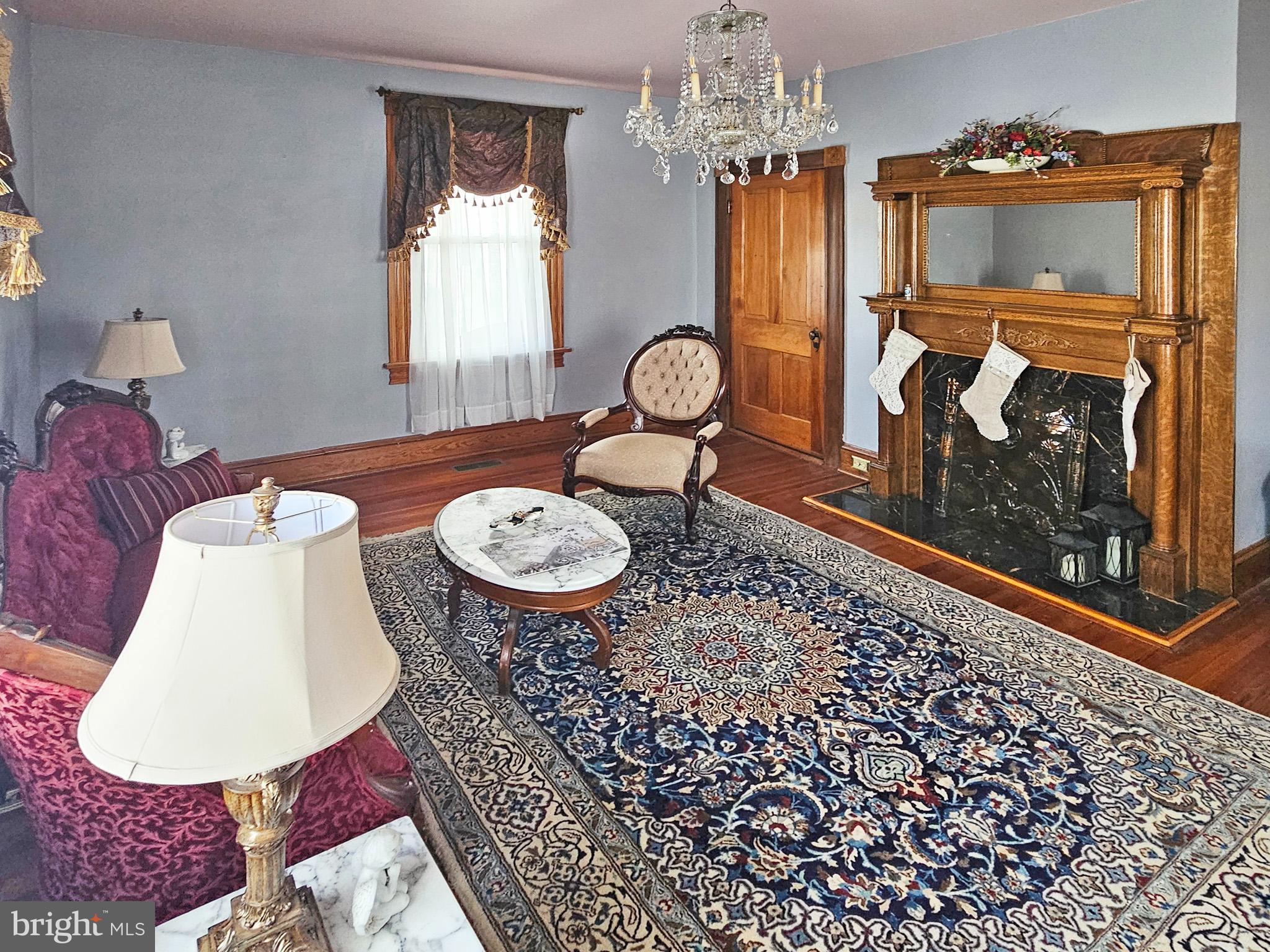 20 Blue Ridge Avenue Front Royal, VA 22630 - Photo 10 of 51 a living room with furniture a window and a fireplace