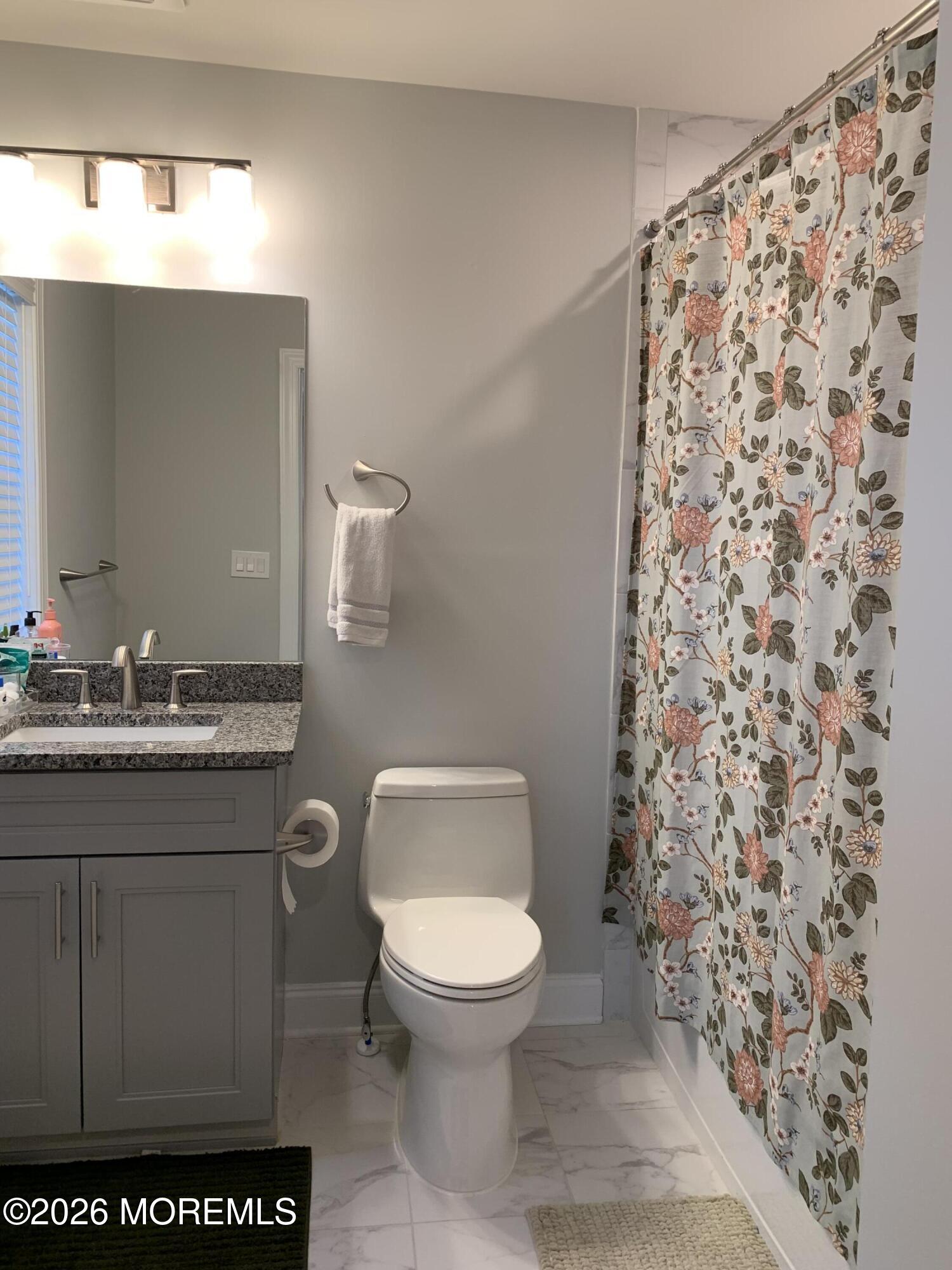67 Samjan Circle Hightstown, NJ 08520 - Photo 21 of 22 a bathroom with a toilet sink and mirror
