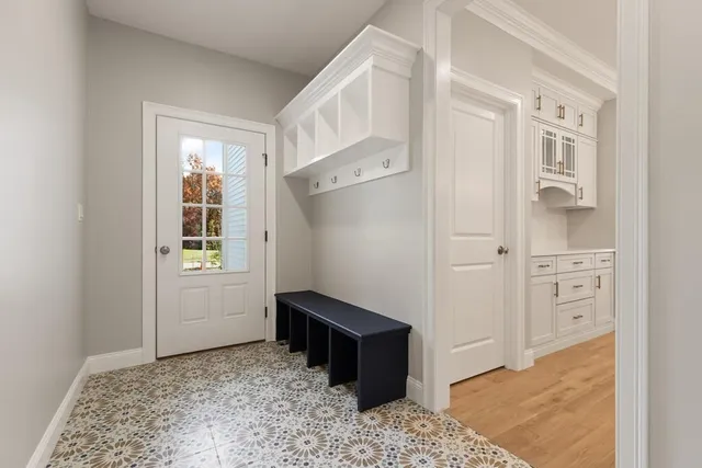 a view of a livingroom with wooden floor and cabinet