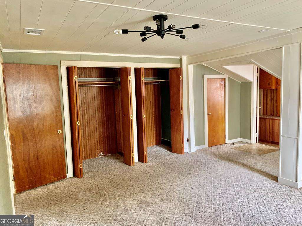 606 West 7th Street Alma, GA 31510 - Photo 11 of 28 a view of empty room with a ceiling fan