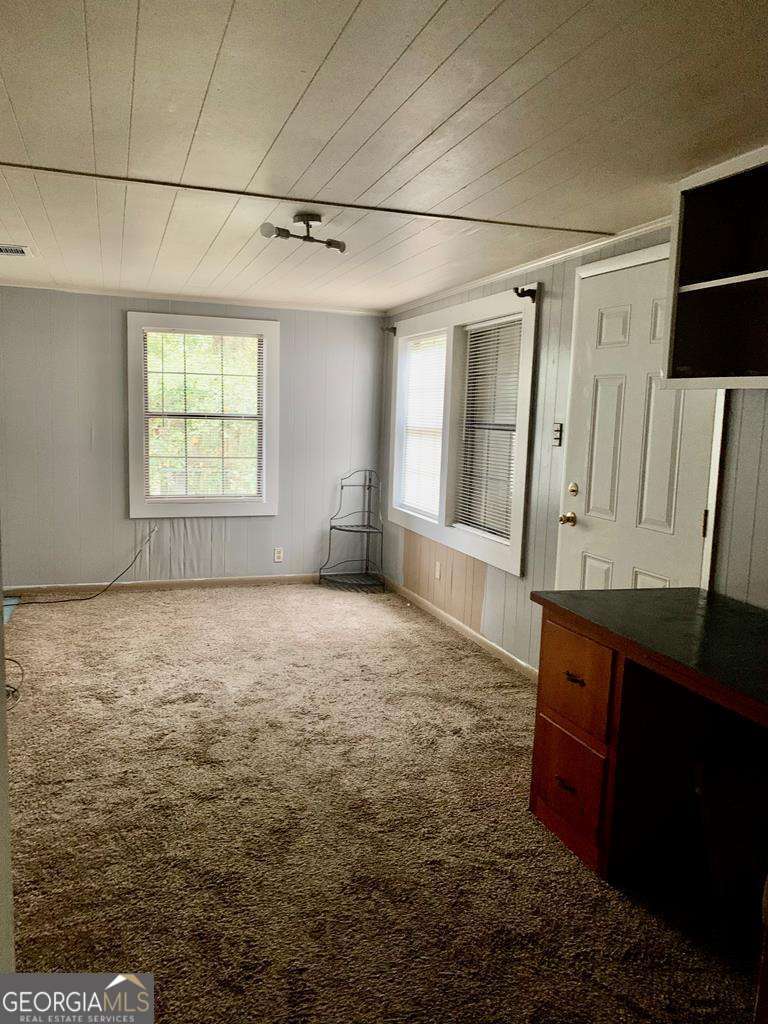 606 West 7th Street Alma, GA 31510 - Photo 20 of 28 a view of an empty room with a window