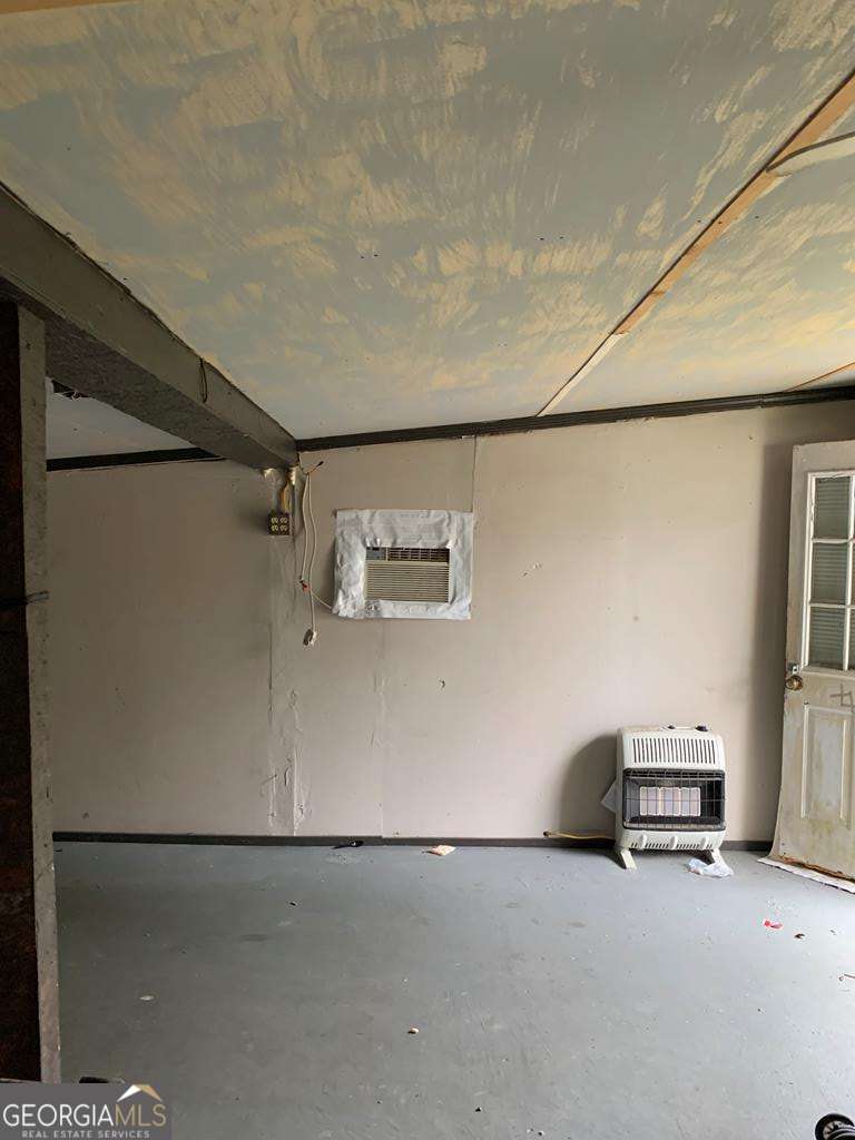 606 West 7th Street Alma, GA 31510 - Photo 26 of 28 a view of storage and utility room with stairs