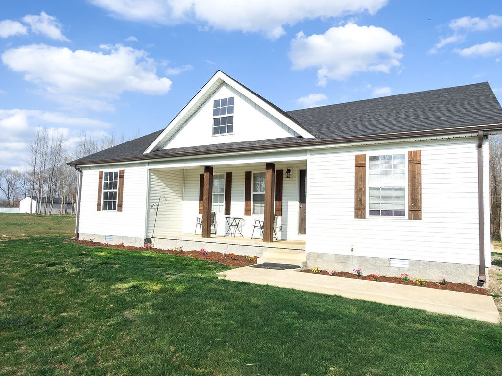 392 Scott Road Sharon Grove, KY 42280 - Photo 11 of 36 a front view of a house with a yard