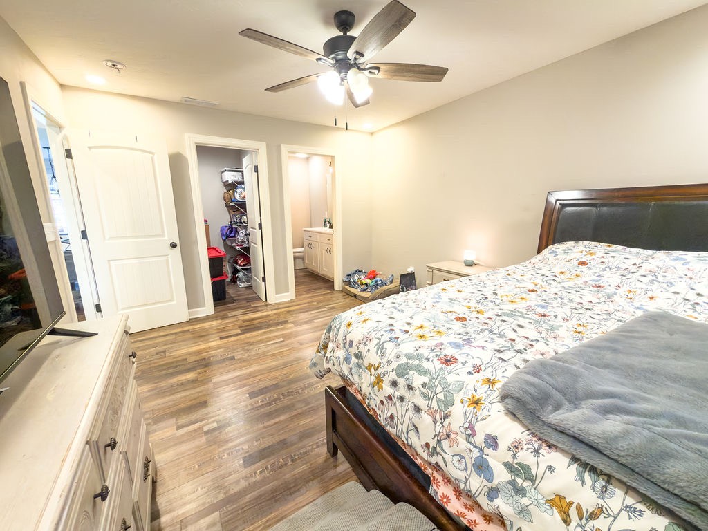 392 Scott Road Sharon Grove, KY 42280 - Photo 13 of 36 a bedroom with a bed and a flat tv screen on dresser