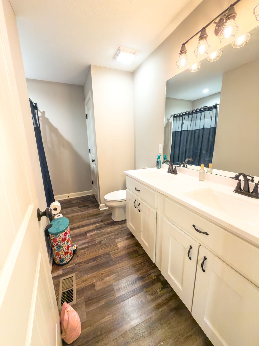 392 Scott Road Sharon Grove, KY 42280 - Photo 2 of 36 a bathroom with a sink mirror vanity and toilet