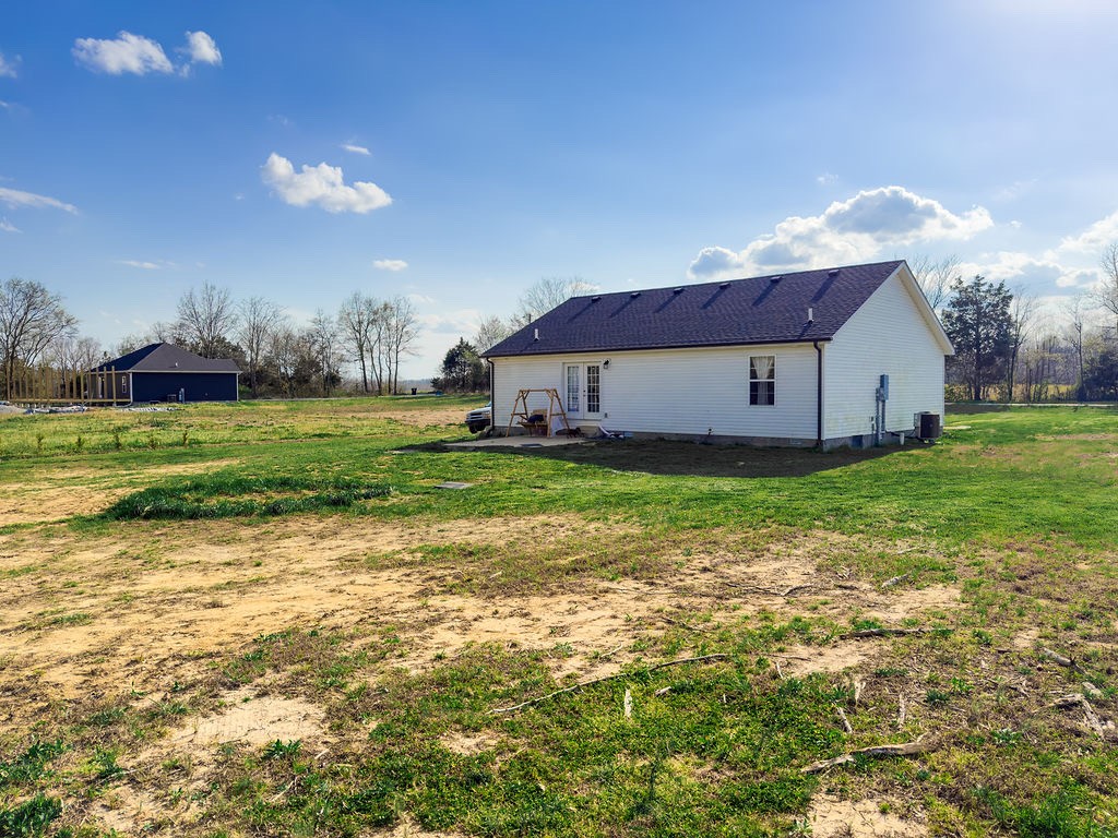 392 Scott Road Sharon Grove, KY 42280 - Photo 21 of 36 a view of a house with a yard and sitting area