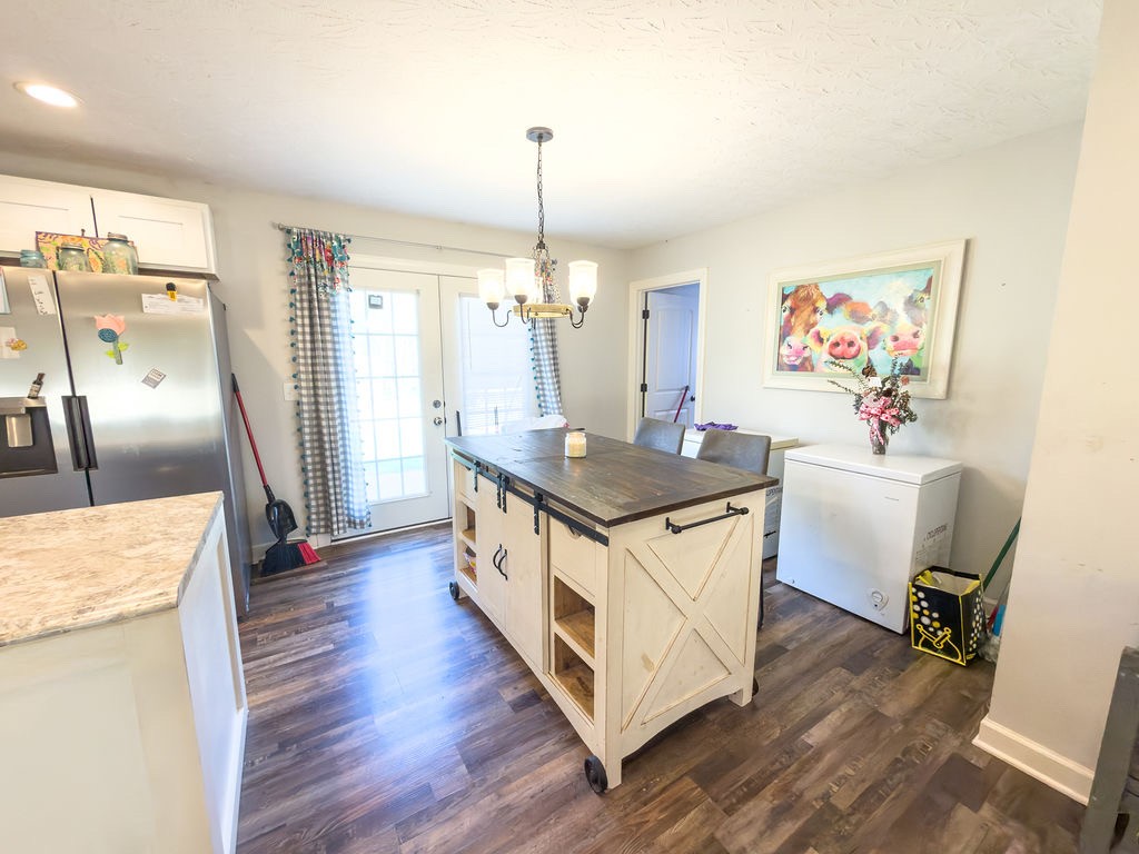 392 Scott Road Sharon Grove, KY 42280 - Photo 34 of 36 a kitchen with a sink stove and wooden floor