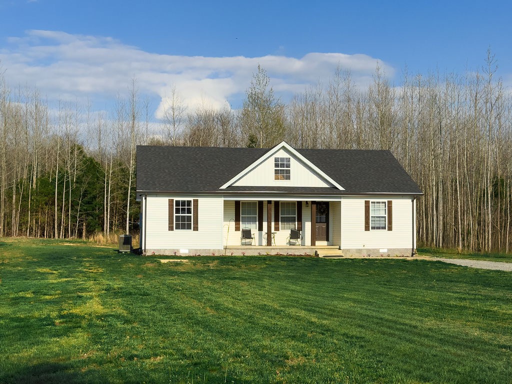 392 Scott Road Sharon Grove, KY 42280 - Photo 36 of 36 a front view of a house with a yard