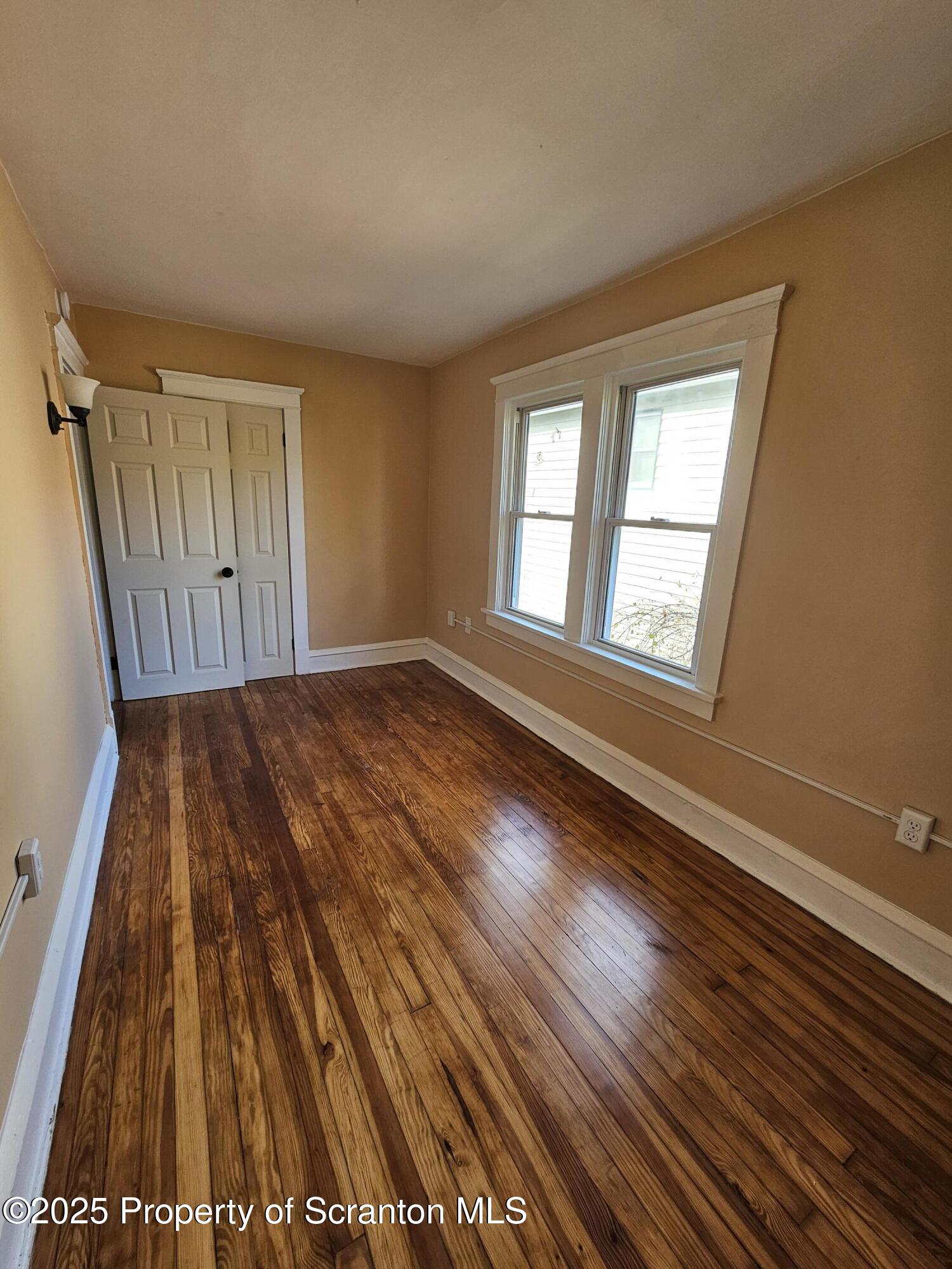 777 Bennett Street Luzerne, PA 18709 - Photo 12 of 17 a view of a room with wooden floor and windows