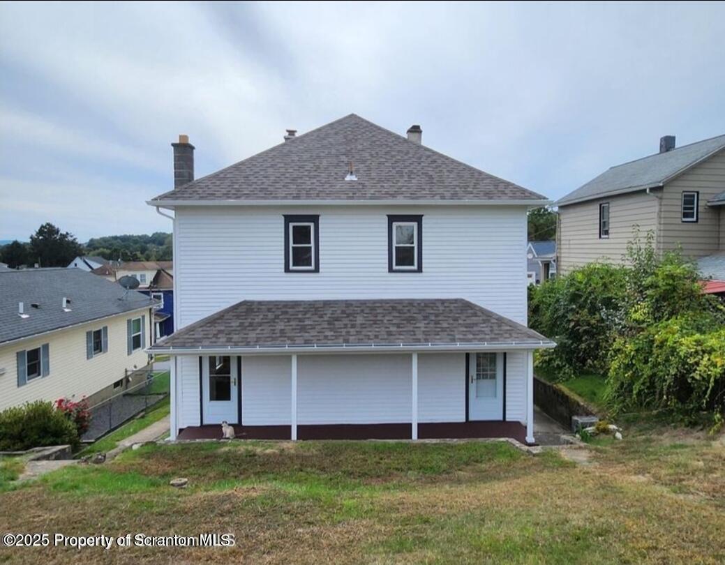 777 Bennett Street Luzerne, PA 18709 - Photo 17 of 17 a front view of a house with a yard and garage