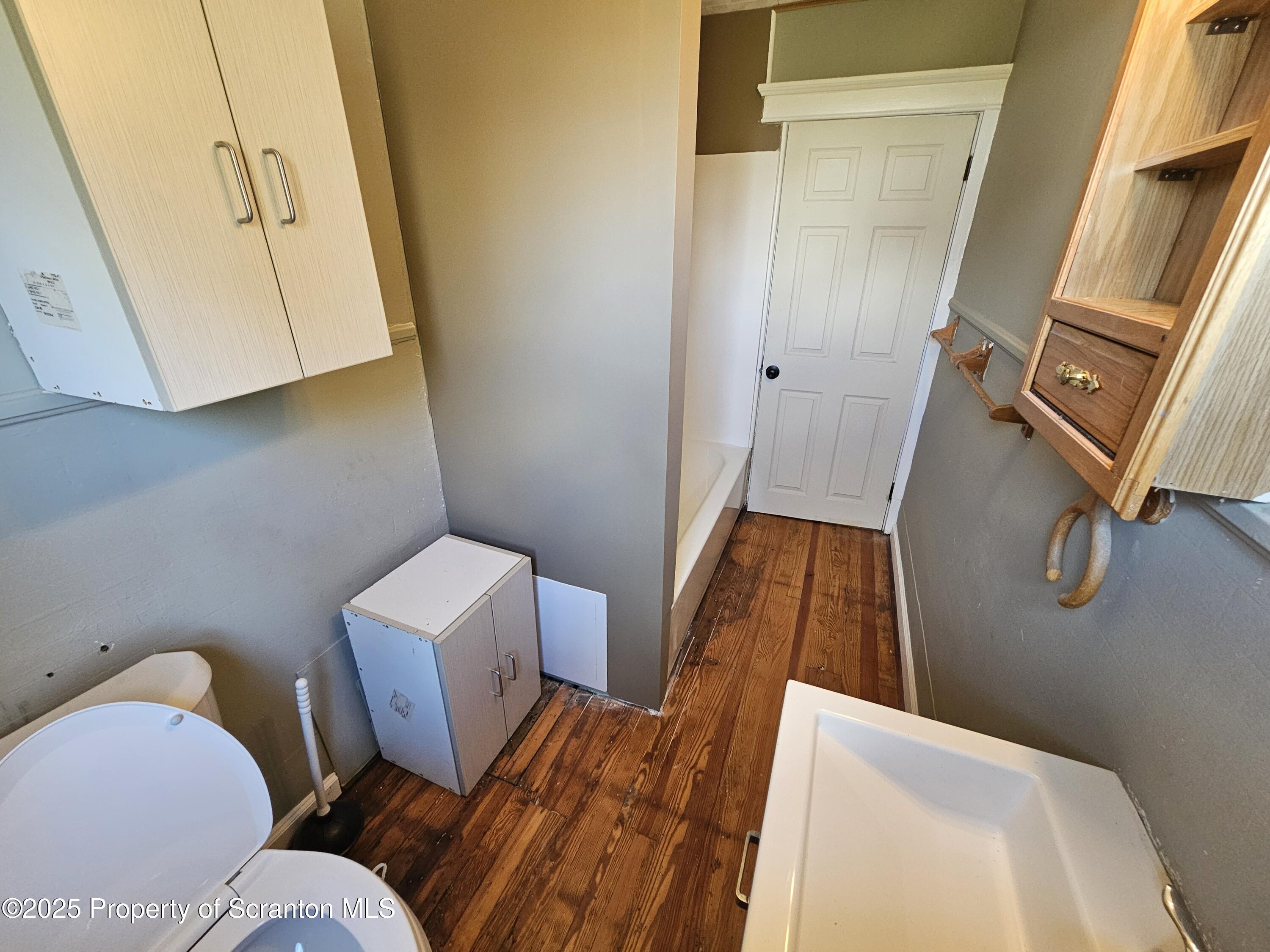 777 Bennett Street Luzerne, PA 18709 - Photo 9 of 17 a bathroom with a sink and a mirror