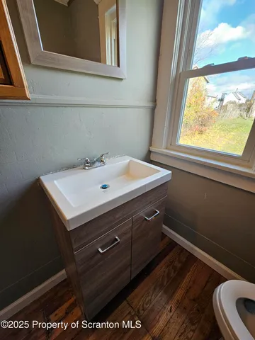 a bathroom with a sink and a window