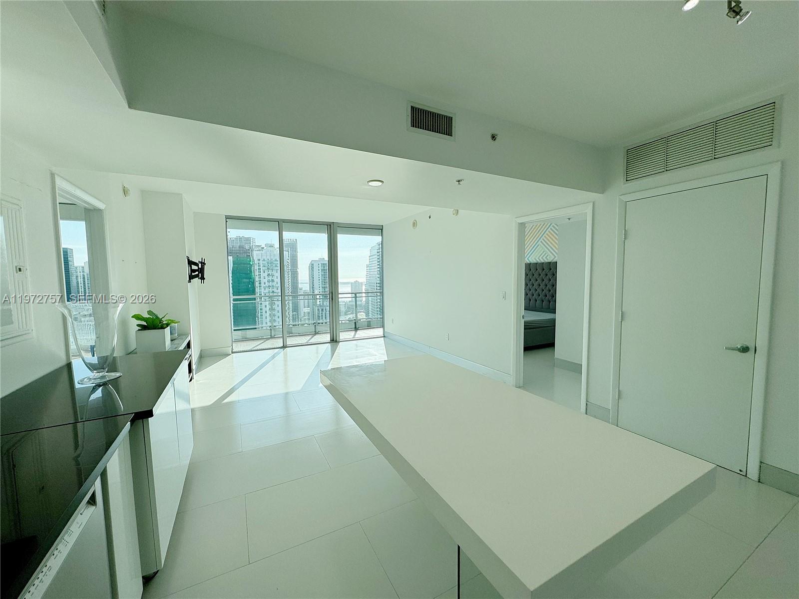 92 Southwest 3rd Street, Unit 3912 Miami, FL 33130 - Photo 9 of 33 a large white room with a large window