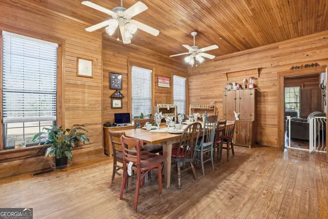 a kitchen with cabinets stainless steel appliances a sink and a window
