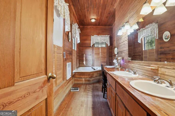 a bedroom with a bed and a mirror