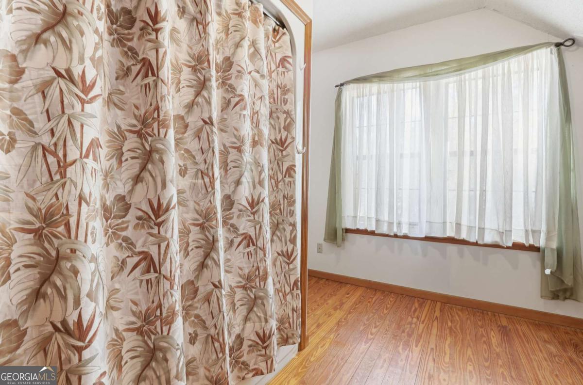 4931 Mill Branch Hunting Clb Road Pembroke, GA 31321 - Photo 33 of 71 a view of a room with wooden floor and a window