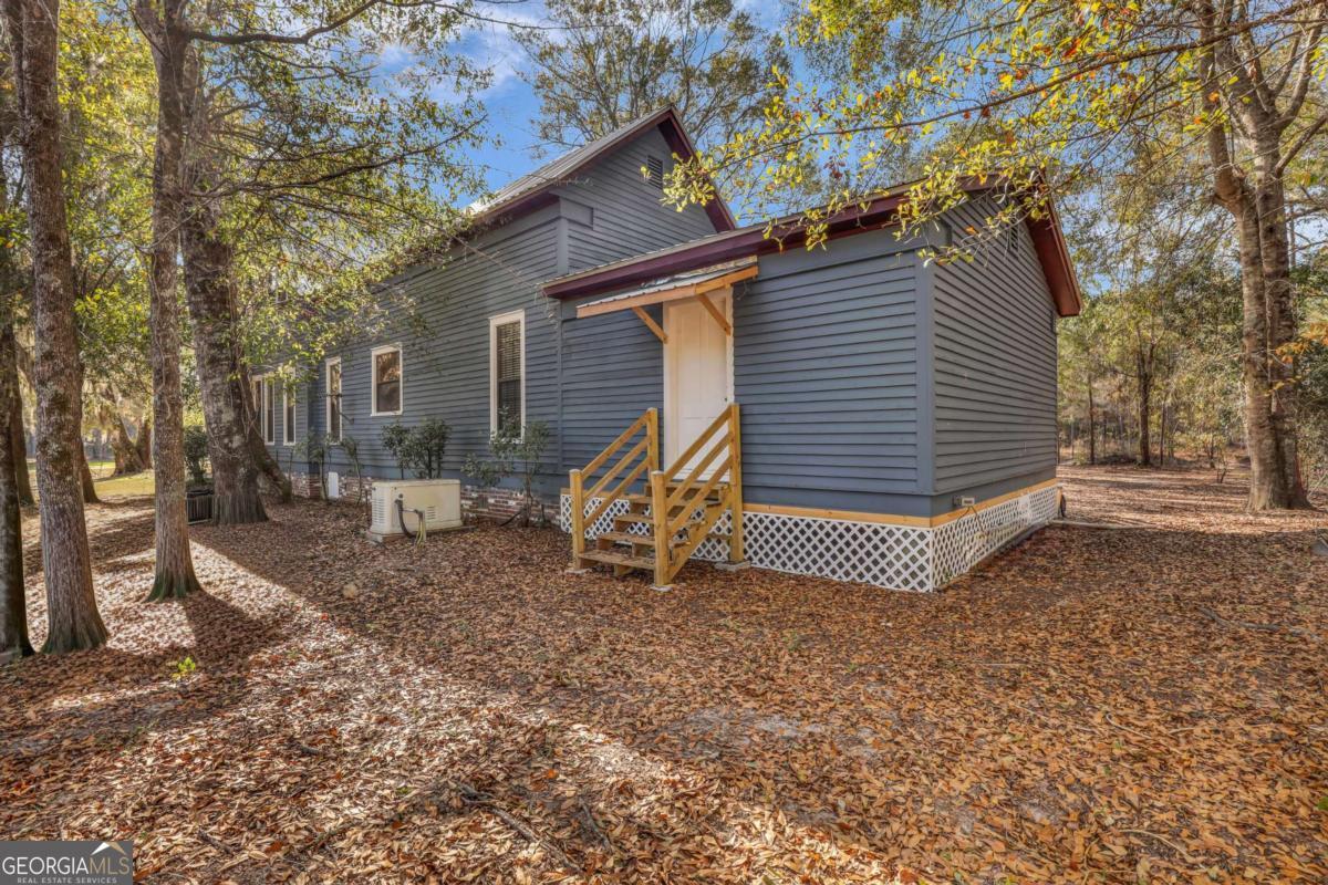 4931 Mill Branch Hunting Clb Road Pembroke, GA 31321 - Photo 47 of 71 a view of a house with a yard
