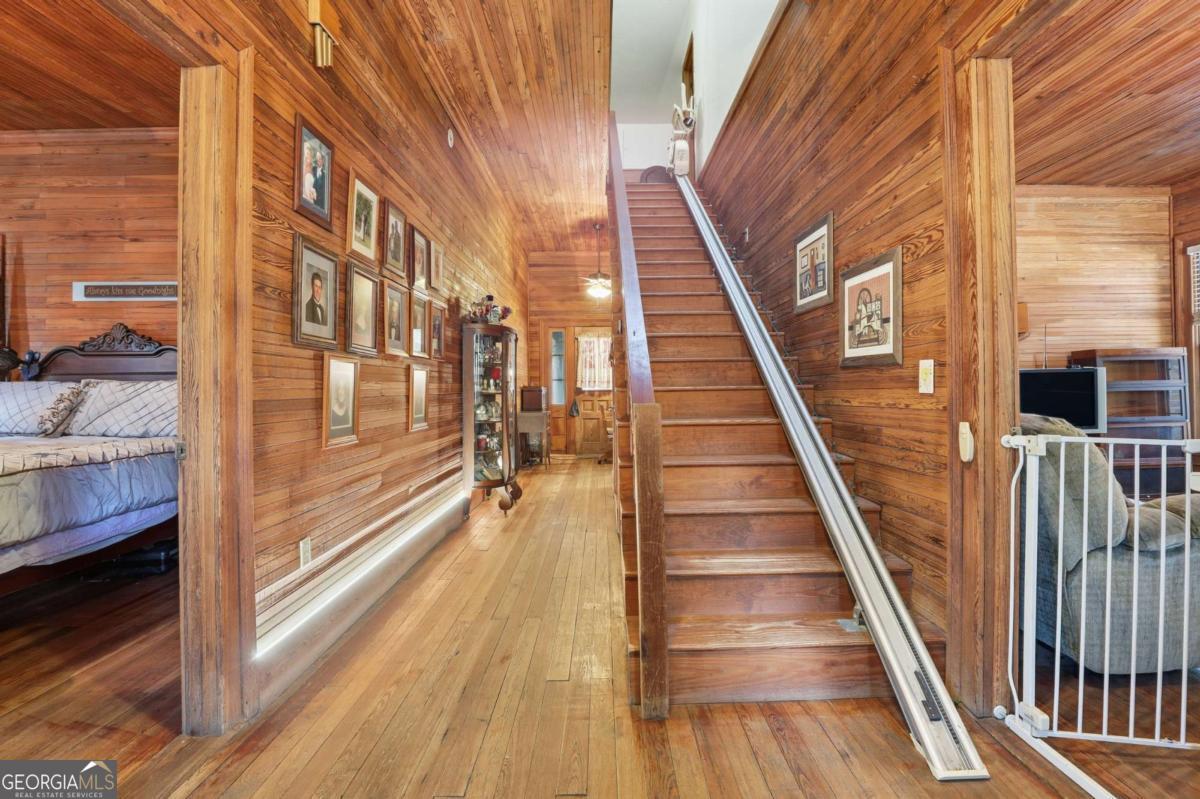4931 Mill Branch Hunting Clb Road Pembroke, GA 31321 - Photo 6 of 71 a view of balcony with wooden floor and stairs