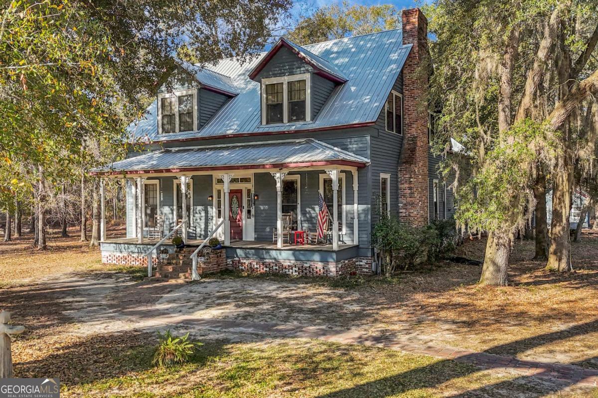 4931 Mill Branch Hunting Clb Road Pembroke, GA 31321 - Photo 69 of 71 a front view of a house with garden