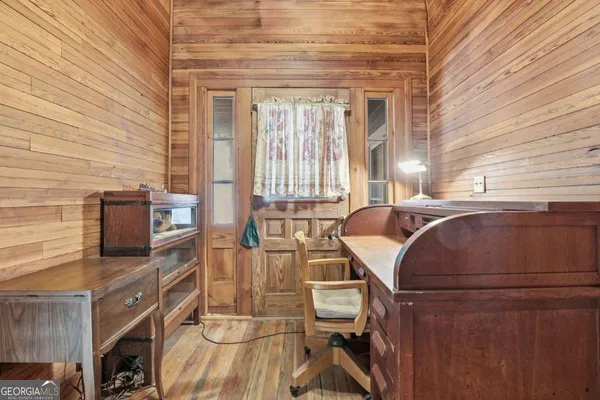 a view of a dining room with furniture window and wooden floor