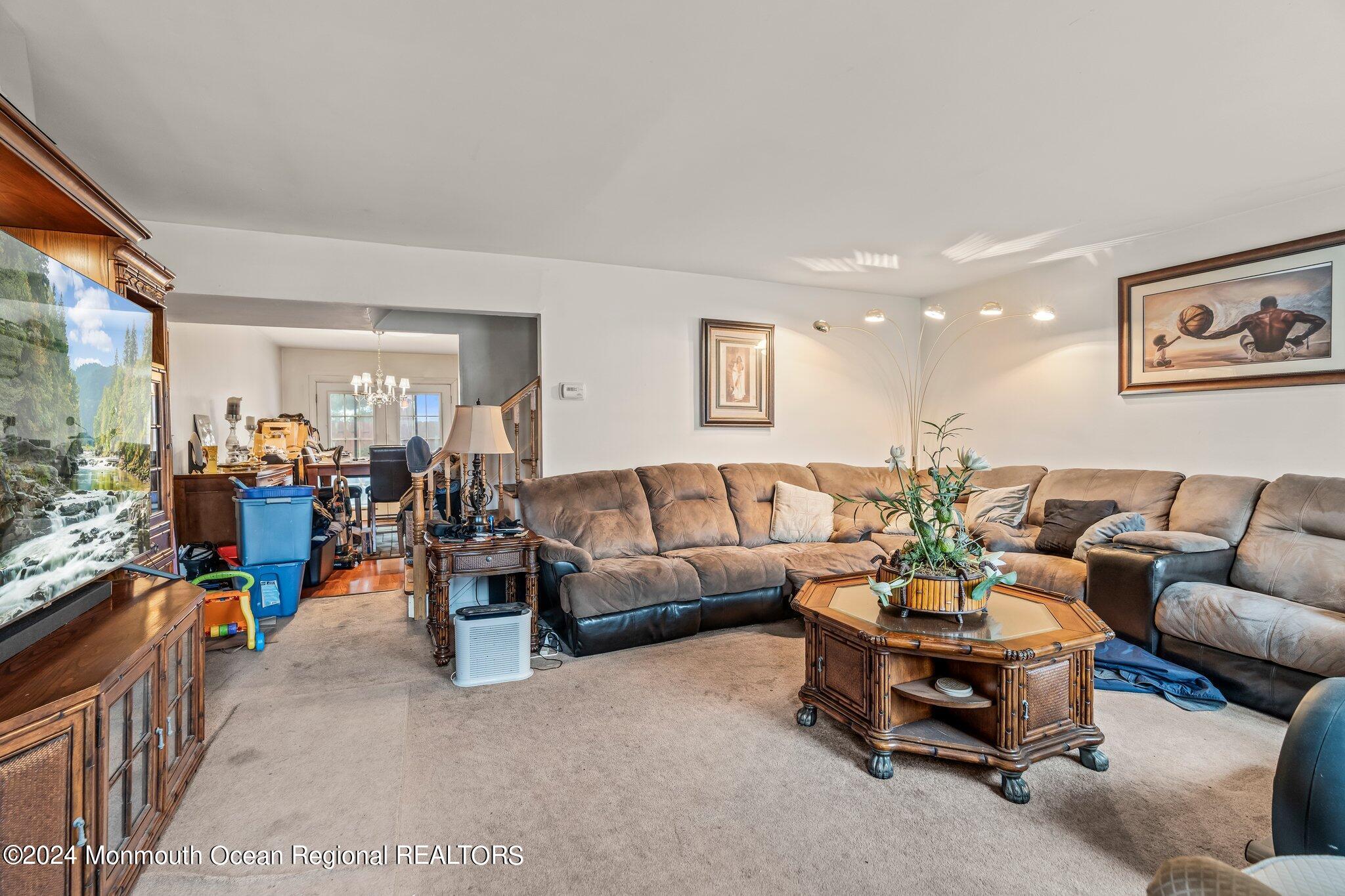 9 Radcliff Place Willingboro, NJ 08046 - Photo 2 of 15 a living room with furniture a couch and a window