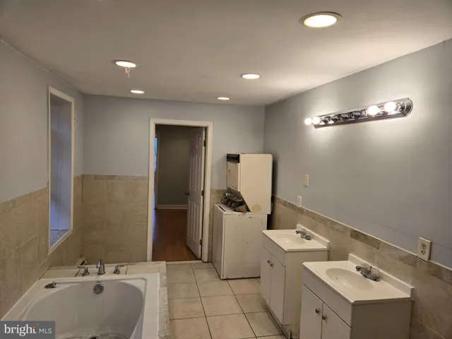 a bathroom with a sink and mirror