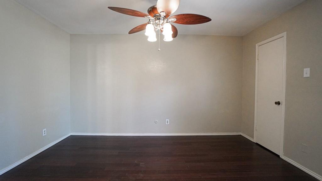 2505 Wedglea Drive, Unit 121 Dallas, TX 75211 - Photo 12 of 24 a view of an empty room with wooden floor